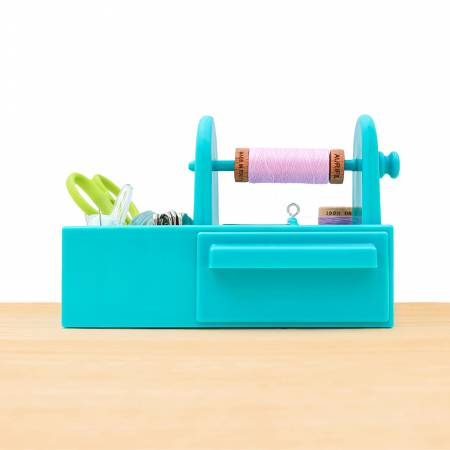 Organize your hand sewing essentials like needles, needle threaders, spools of thread, small scissors, pins, and other small notions.
• Keep one by your sewing machine for sewing machine needles, bobbins, extra sewing machine feet, seam rippers, needle threaders, small rulers, pins, and more.
• Cross stitchers will find lots of places to store their floss bobbins, needles, needle threaders, needle minders, and thread gloss.
English paper piecing enthusiasts will find plenty of space to organize their paper