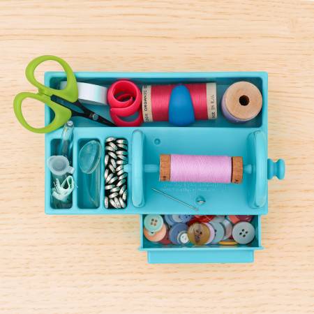 Organize your hand sewing essentials like needles, needle threaders, spools of thread, small scissors, pins, and other small notions.
• Keep one by your sewing machine for sewing machine needles, bobbins, extra sewing machine feet, seam rippers, needle threaders, small rulers, pins, and more.
• Cross stitchers will find lots of places to store their floss bobbins, needles, needle threaders, needle minders, and thread gloss.
English paper piecing enthusiasts will find plenty of space to organize their paper
