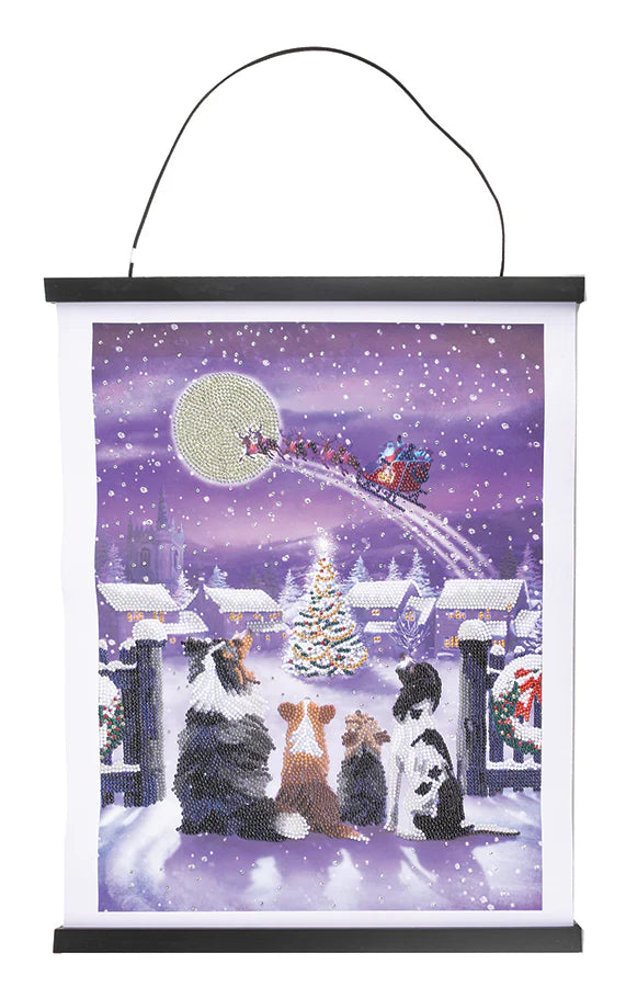 Scroll Kit-Festive Full Moon - Crystal Art-Behold our enchanting Crystal Art Scroll Kit, where the magic of Christmas comes to life in a captivating scene straight out of a winter wonderland tale. At the heart of the scene lies a quaint village nestled amidst a blanket of freshly fallen snow. In the center of the village square stands a majestic Christmas tree, adorned with twinkling lights and shimmering ornaments that cast a warm glow over the surrounding landscape.
