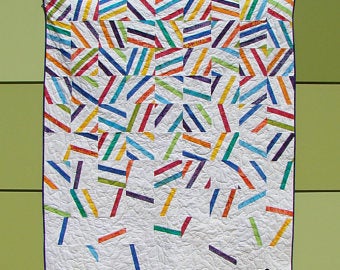 Party Pop Quilt Pattern - Slice of Pi
Party Pop is a bright and cheery quilt perfect for all the celebrations in your life! The quilt looks great in a limited color palette or the whole rainbow. This beginner-friendly pattern uses fat eighths plus one background fabric and includes directions for three sizes.