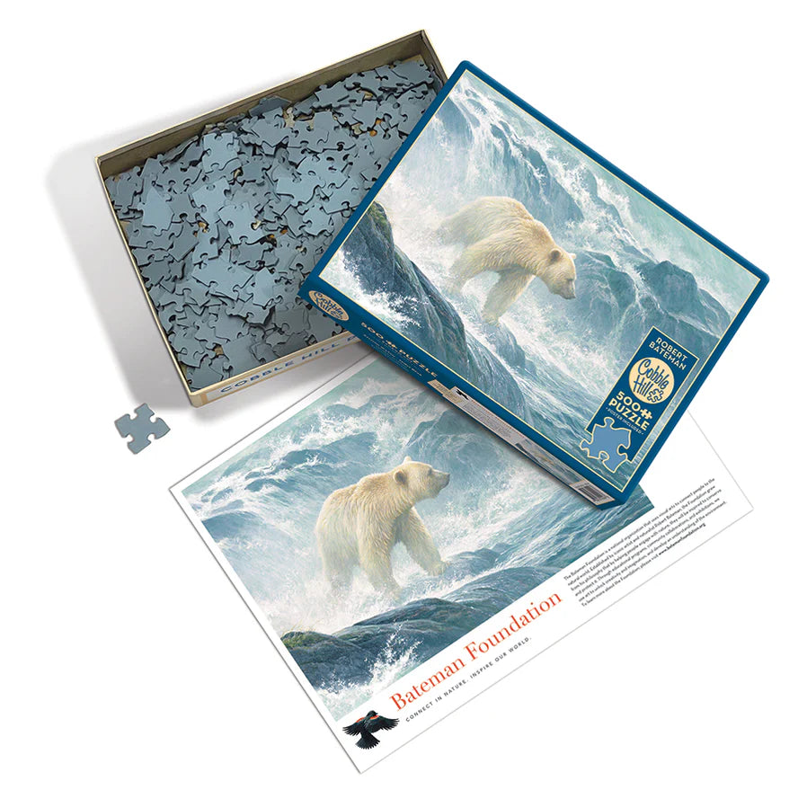 Salmon Watch - Spirit Bear - 500 Piece
From Cobble Hill
Salmon Watch Spirit Bear is a wildlife image by Robert Bateman created in a 500 piece puzzle. A white polar bear walks along a rocky surface of the water and behind him is a small waterfall cascading down creating a huge splash on what appears to be a misty day. Own a beautiful Bateman piece of art for your home by assembling this challenging wildlife puzzle.