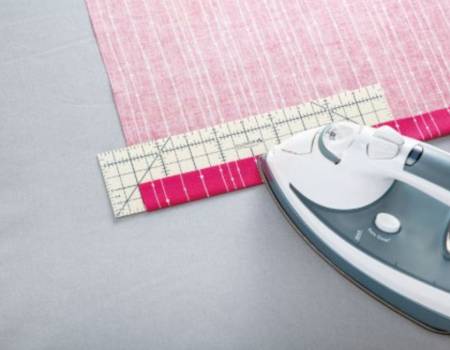 Hot Ruler - 10 inch
By Clover
Measure, mark, fold, press: deep hems, long hems, miter corners. Heat resistant, press directly on the ruler. Can be used with dry or steam iron. Unique non-slip surface holds fabric in place for precise results. 2.5in x 10in (63.5cm x 254cm)
Color: White
Made of: Nylon
Pressing Tool