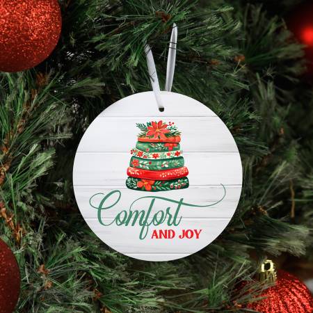 Comfort and Joy Ornament
This dazzling ornament is the perfect way to celebrate and acknowledge the dedication and passion behind every quilted masterpiece. Featuring an elegant and festive design, it radiates joy and appreciation in equal measure. With a radiant, glossy finish and durable construction, this ornament not only looks stunning but promises longevity.