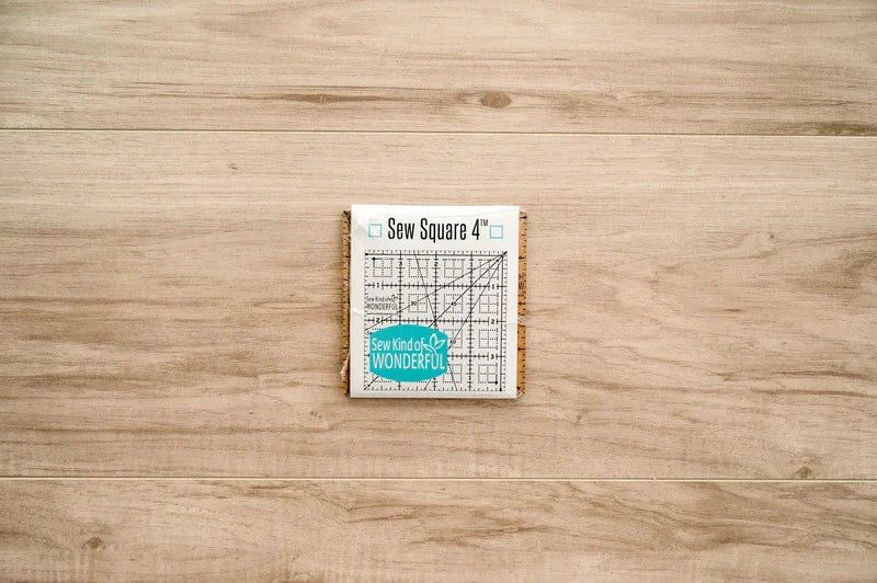Sew Square 4™ - Sew Kind of Wonderful
Sew Square 4™ is a 4" x 4" clear acrylic ruler with easy to use black lines and marks.
Sew Square 4™ has unique marks for squaring up 4" x 4" units from multiple Sew Kind of Wonderful patterns.