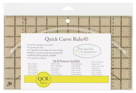 Quick Curve Ruler
From Sew Kind of Wonderful
This ruler is to be used with all Sew Kind of Wonderful© patterns. It is used to cut the curve shapes out and square the blocks up after piecing; easy method for cutting and sewing curves.
The ruler is a quality acrylic ruler with a curve cut out, where your rotary blade of any size will fit into. It's 7" x 12" in size and has a hang hole for storage convenience.