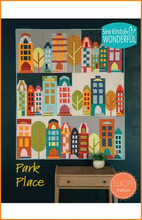 The Park Place quilt pattern is a delightful house-themed design that blends straight and curved piecing to create a charming village scene. Measuring 55" x 63", this pattern is perfect for showcasing a variety of small scale fabrics.