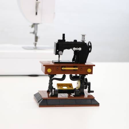 Sallie Tomato Vintage Sewing Machine Building Block Set. Use this 250+ piece set to build a mini Vintage Sewing Machine! This set is meant to be displayed as a decorative piece. It is non-functional, not intended for frequent use. It is also not intended for children. This is not an actual sewing machine.