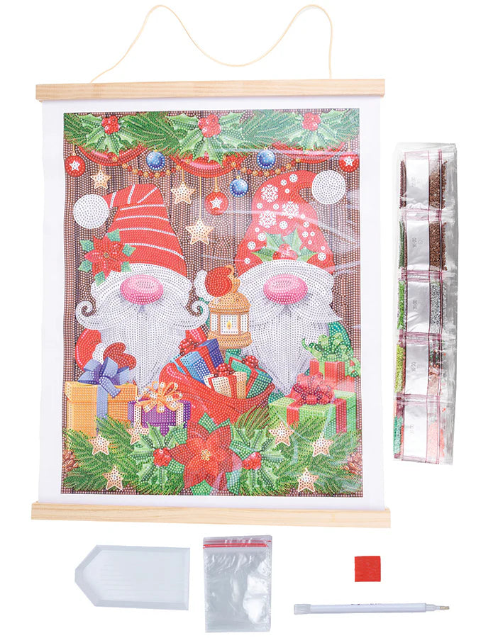 Scroll Kit-Christmas Gnomes - A delightful holiday-themed craft experience that brings the magic of Christmas to life with sparkling crystals and festive gnomes.
Imagine unrolling the scroll to reveal a charming scene filled with whimsical Christmas gnomes surrounded by presents, garlands, lanterns, and the timeless beauty of poinsettias. Each element is intricately detailed, waiting to be adorned with a dazzling array of crystals. 