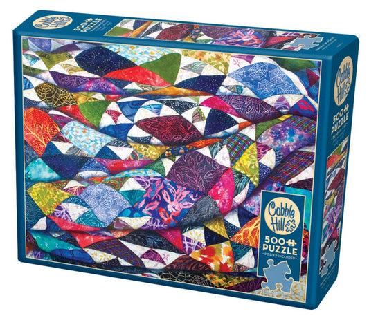 Portrait of a Quiltt Puzzle - 500 PC Puzzles - Radom Cut  From Cobble Hill  Finished Size: 26.625" x 19.25"  Poster Included  The Portrait of a Quilt has patches of blues and purples highlighted with hues of gold that warm up this patchwork. 