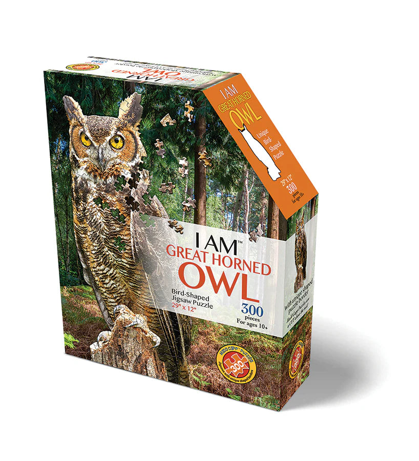 I AM a Great Horned Owl- 300 Piece
From Cobble Hill
Meet I AM Great Horned Owl, the majestic Madd Capp jigsaw puzzle that will have you hooting with delight (literally)! This 300-piece puzzle will have you soaring through the night sky as you assemble this feathered friend perched atop a tree stump. Put together this beautiful owl and show off the wingspan of your puzzling prowess!