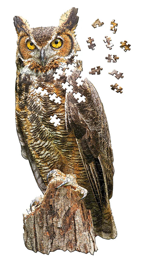 I AM a Great Horned Owl- 300 Piece
From Cobble Hill
Meet I AM Great Horned Owl, the majestic Madd Capp jigsaw puzzle that will have you hooting with delight (literally)! This 300-piece puzzle will have you soaring through the night sky as you assemble this feathered friend perched atop a tree stump. Put together this beautiful owl and show off the wingspan of your puzzling prowess!